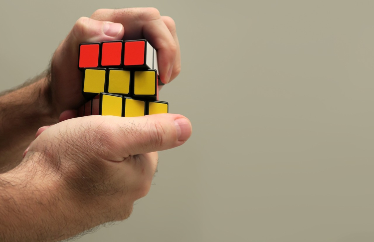 man solving a rubix cube