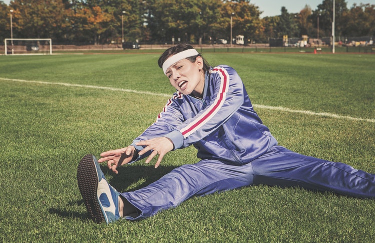 woman stretching humorously 