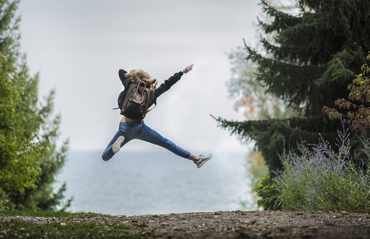 happy woman jumping for joy