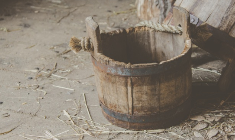 escape room puzzle: old bucket in a barn