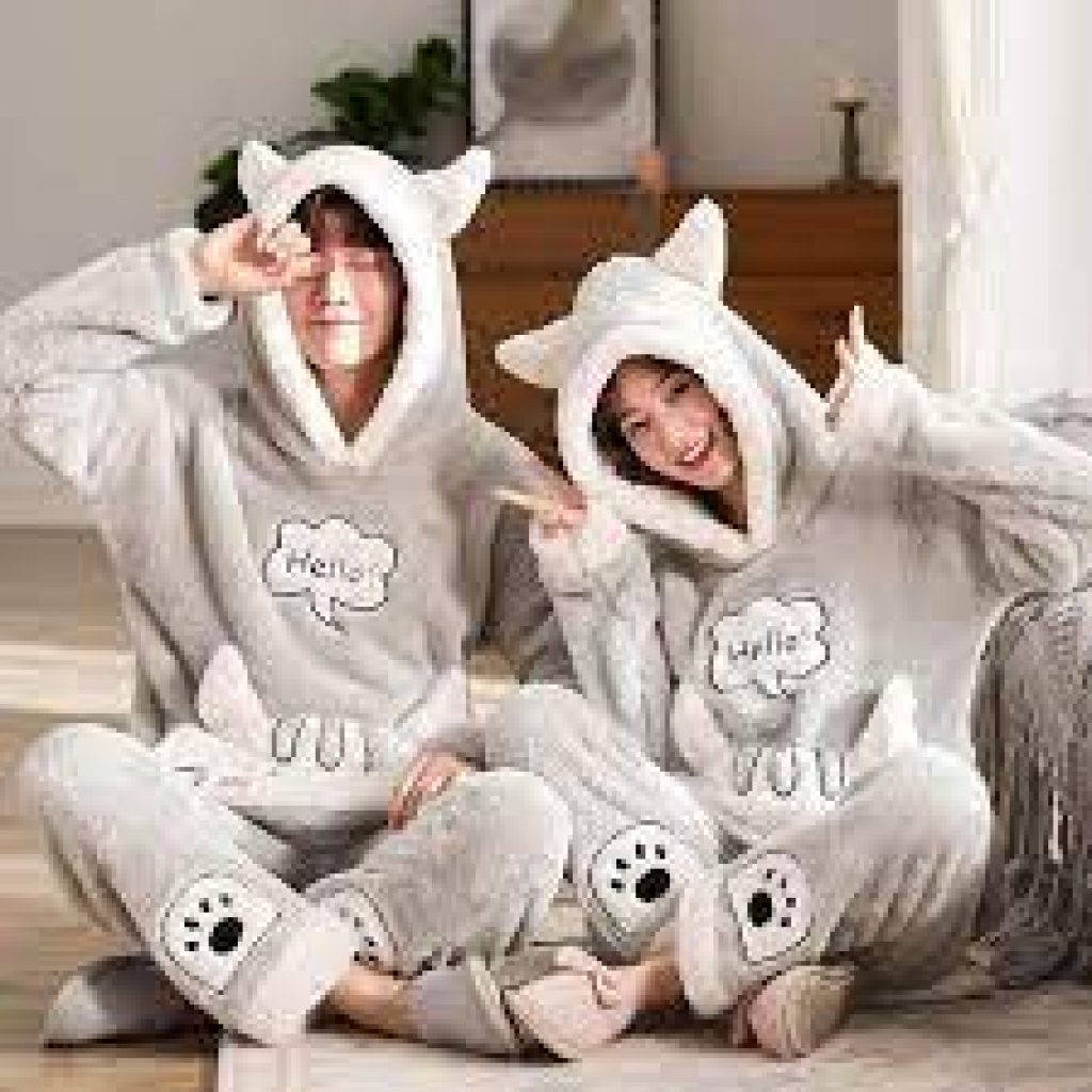 Couple wearing matching bear pajama set.